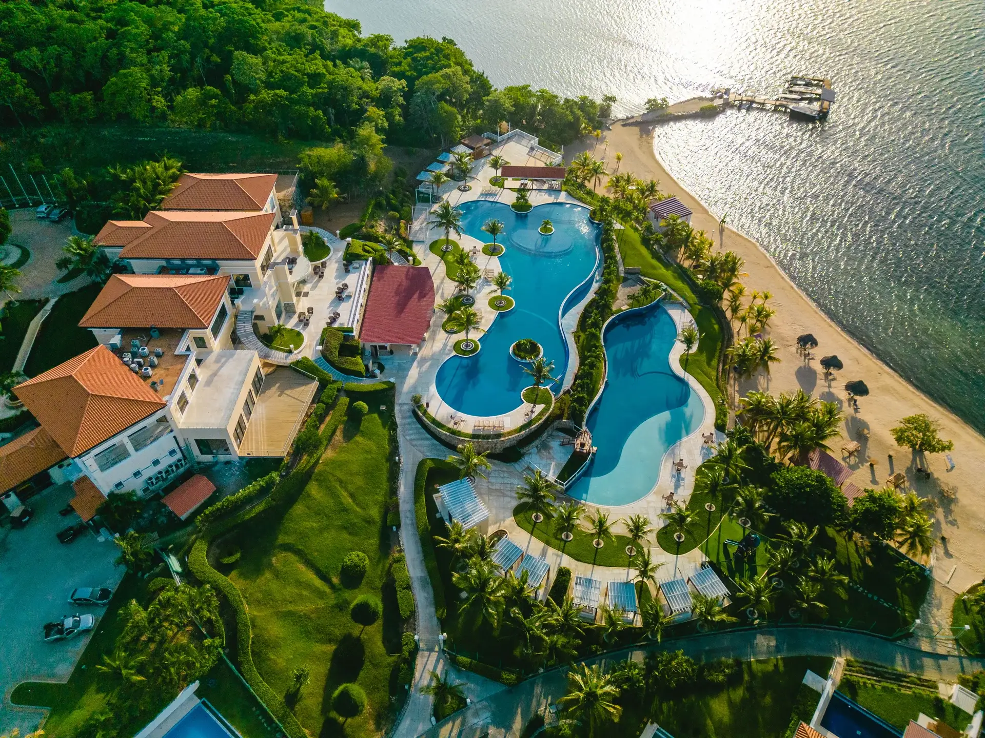 Aerial view of The Club’s pools and beachfront at Pristine Bay