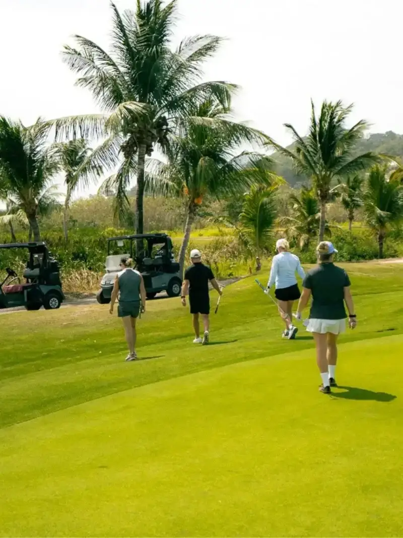 Golfers walking the fairway at The Black Pearl in Roatán